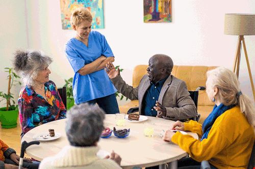 Group Of Residents At Recreation Table